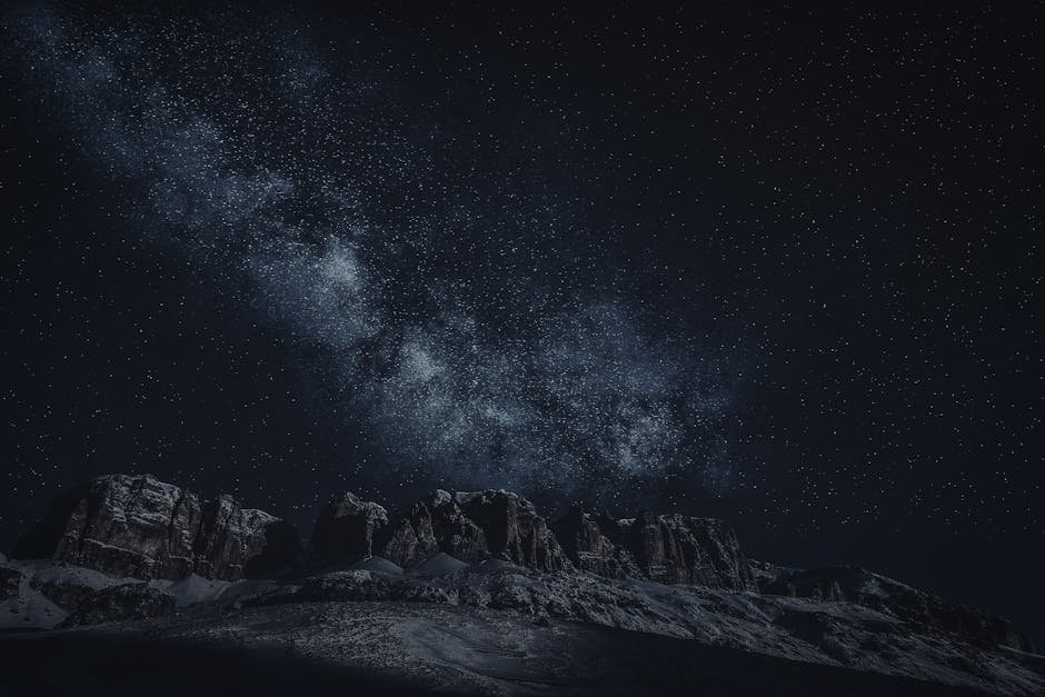 Majestic view of the Milky Way above rugged mountain ranges under a starry sky.