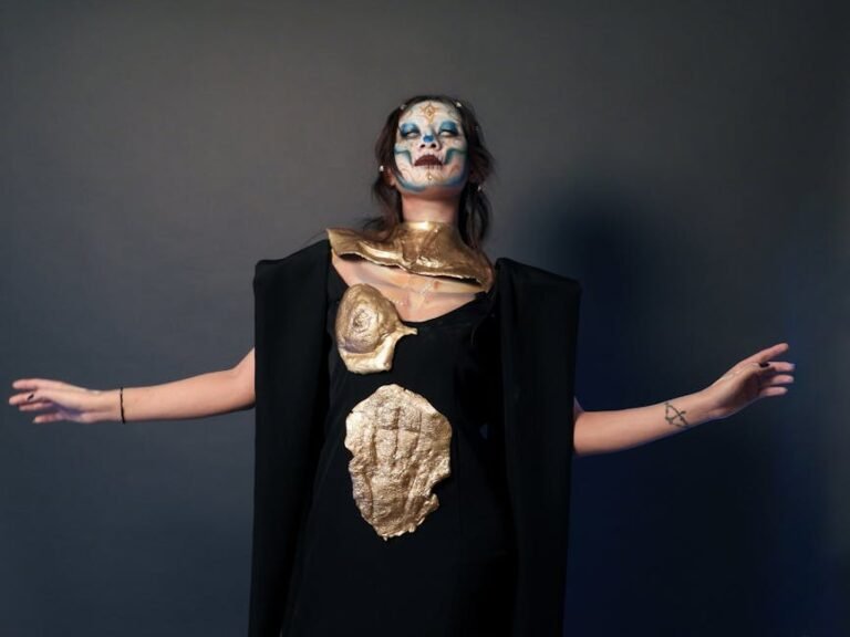 Striking portrait with Day of the Dead makeup and costume, captured in a studio setting.