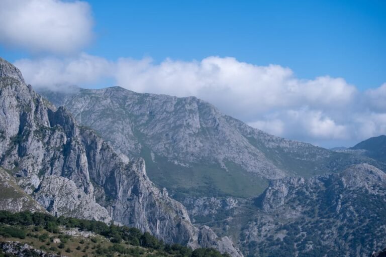 Breathtaking view of rugged mountain terrain under a bright blue sky.