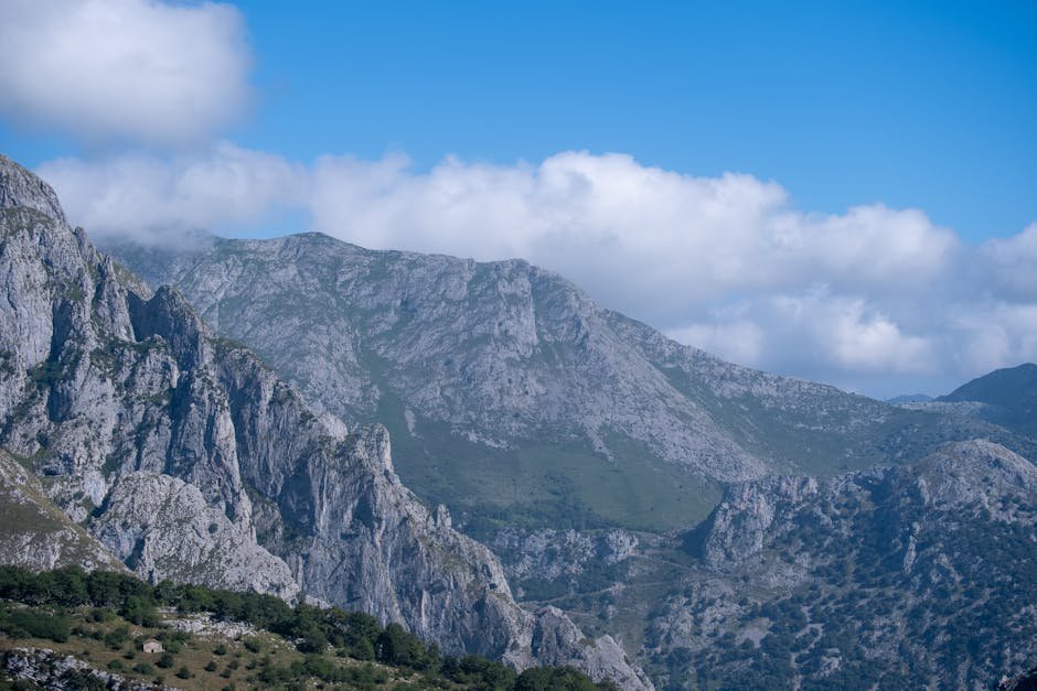 Breathtaking view of rugged mountain terrain under a bright blue sky.